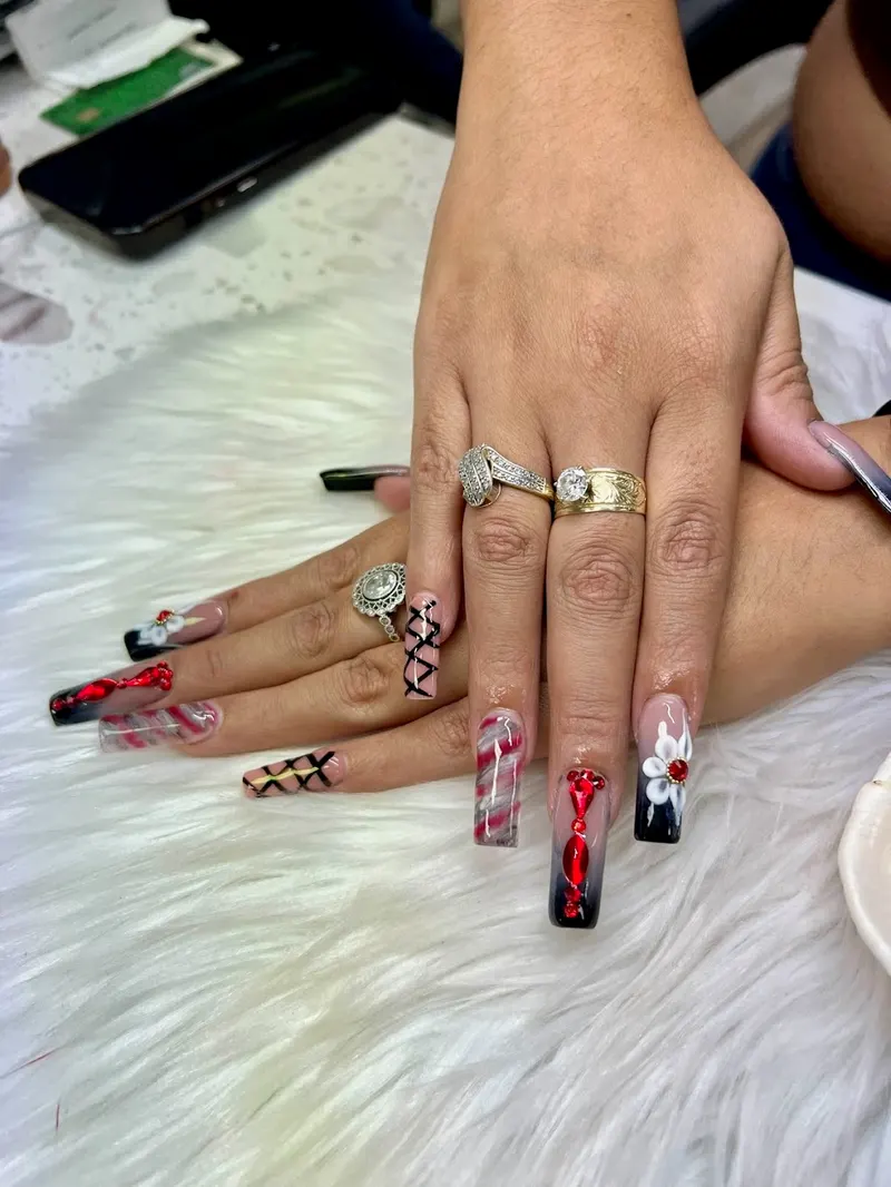 Deep red French tip nails with a glossy finish