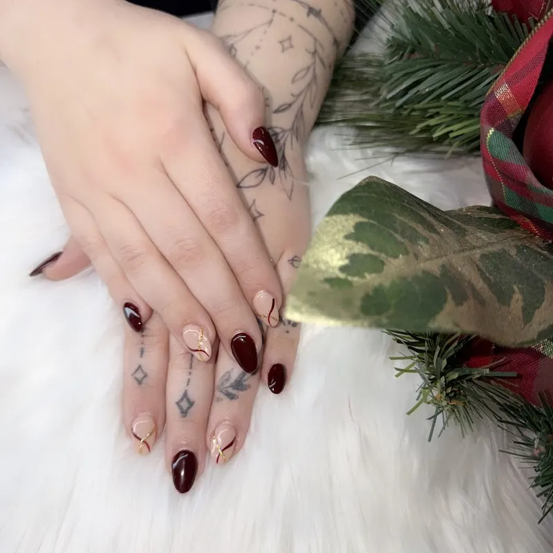 Rich burgundy gel manicure with a glossy, chip-resistant finish