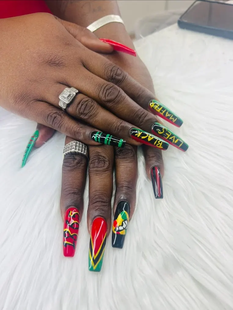 Long coffin nails with bright, bold custom nail art