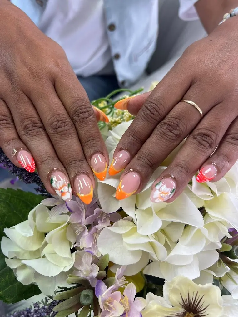 Festive confetti nail art with soft floral accents